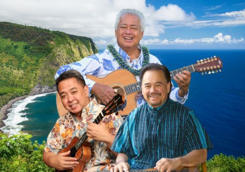 Three men are playing musical instruments against a scenic coastal backdrop with lush greenery and ocean views.